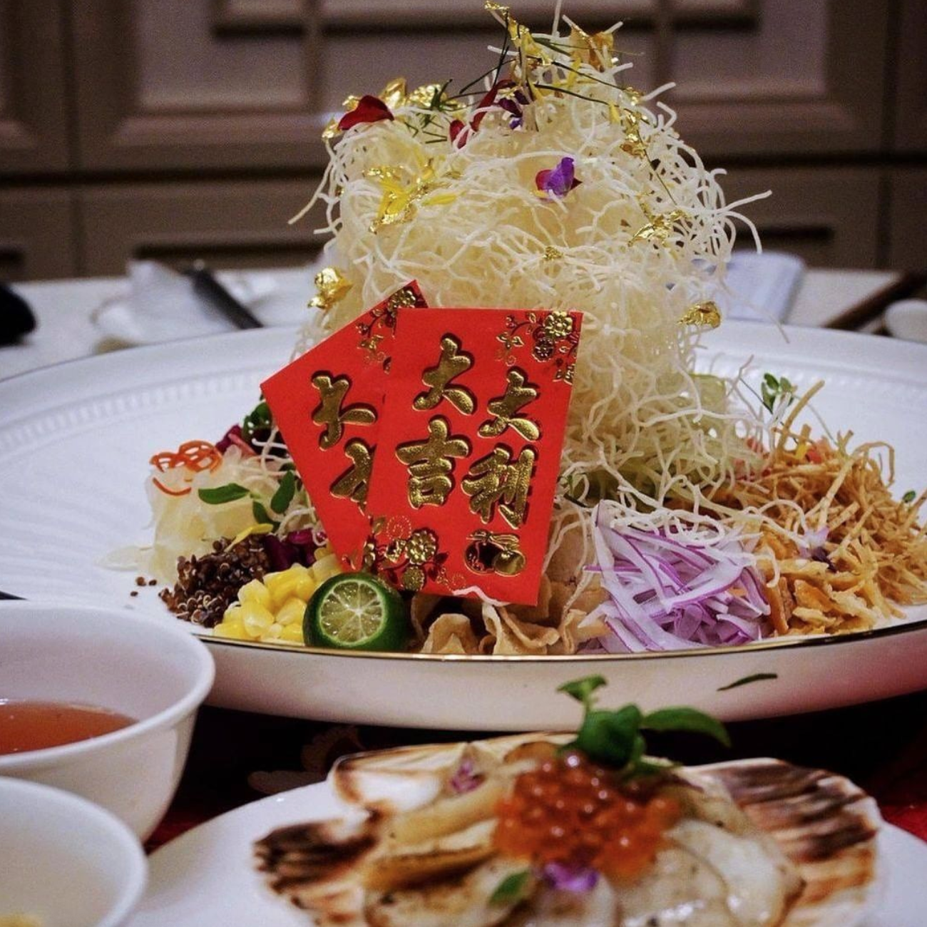 Lo Hei garnished with gold shavings