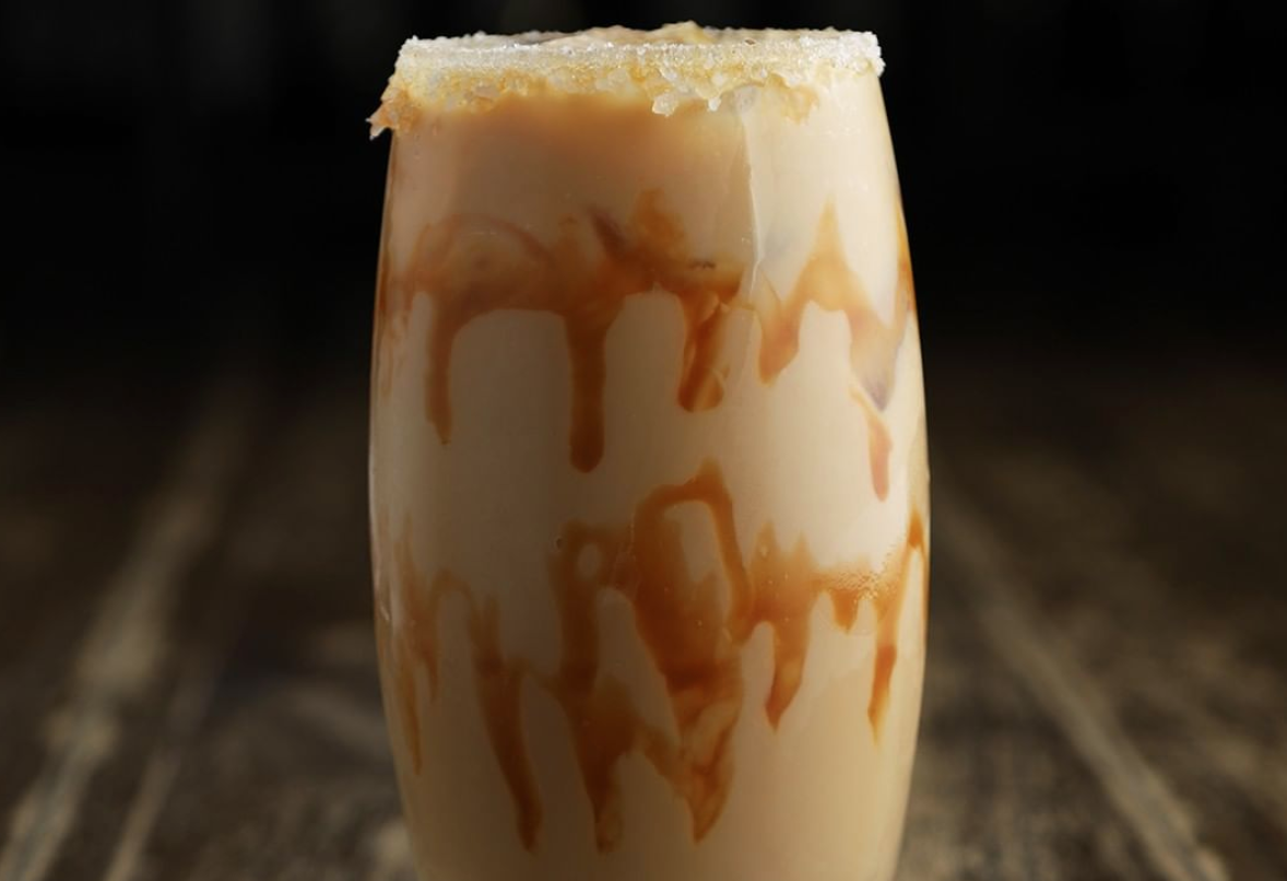 A caramel latte in a glass